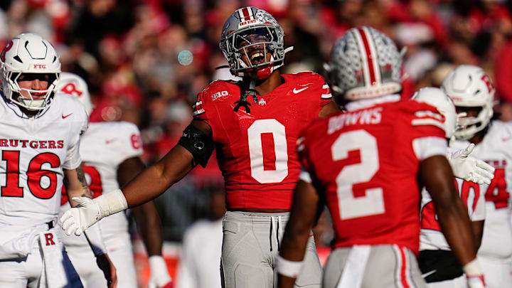 Ohio State Buckeyes linebacker Sonny Styles (0) celebrates a sack by defensive back Caleb Downs (2)