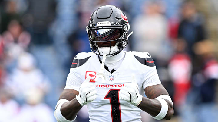 Oct 13, 2024; Foxborough, Massachusetts, USA; Houston Texans wide receiver Stefon Diggs (1) reacts before a game against the New England Patriots at Gillette Stadium. Mandatory Credit: Brian Fluharty-Imagn Images