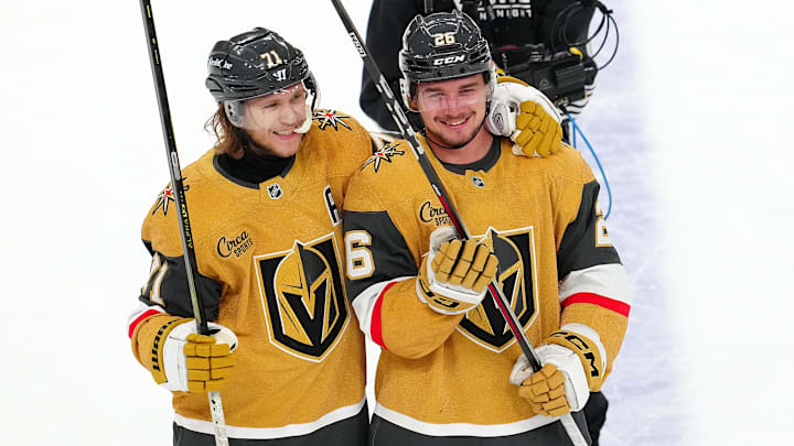 Apr 12, 2025; Las Vegas, Nevada, USA; Vegas Golden Knights center William Karlsson (71) celebrates with Vegas Golden Knights right wing Alexander Holtz (26) after the Golden Knights defeated the Nashville Predators 4-3 at T-Mobile Arena. Mandatory Credit: Stephen R. Sylvanie-Imagn Images