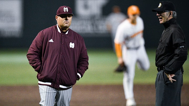 Mississippi State baseball coach Chris Lemonis talks with an official during the NCAA baseball game