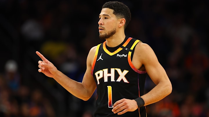 Phoenix Suns guard Devin Booker (1) reacts after a play against the Oklahoma City Thunder during the first half at Footprint Center.