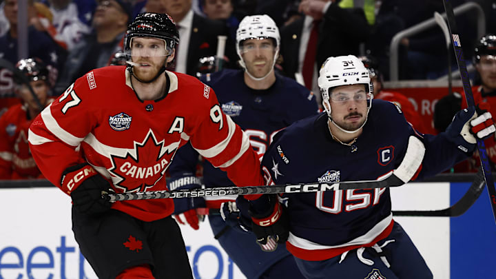 Feb 20, 2025; Boston, MA, USA; [Imagn Images direct customers only] Team Canada forward Connor McDavid (97) and United States forward Auston Matthews (34) during the 4 Nations Face-Off ice hockey championship game at TD Garden. Mandatory Credit: Winslow Townson-Imagn Images