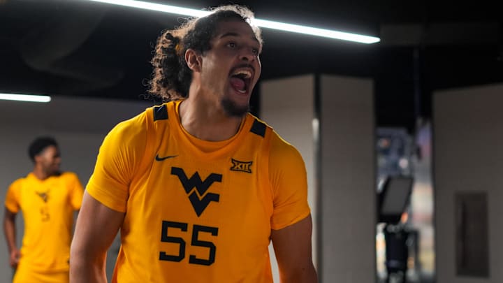 Feb 5, 2026; Cincinnati, Ohio, USA;  West Virginia Mountaineers center Harlan Obioha (55) celebrates after his team’s win against the Cincinnati Bearcats at Fifth Third Arena. Mandatory Credit: Aaron Doster-Imagn Images