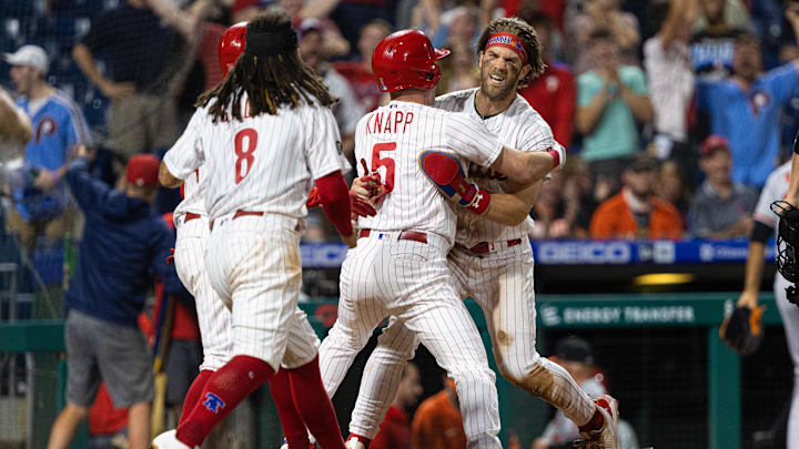 Sep 21, 2021; Philadelphia, Pennsylvania, USA; Philadelphia Phillies right fielder Bryce Harper (3) reacts with catcher Andrew Knapp (5) after scoring the game winning run against the Baltimore Orioles during the tenth inning at Citizens Bank Park.