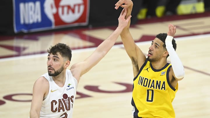 May 6, 2025; Cleveland, Ohio, USA; Cleveland Cavaliers guard Ty Jerome (2) defends Indiana Pacers guard Tyrese Haliburton (0) on a follow through for a game-winning three-point basket in the fourth quarter during game two of the second round of the 2025 NBA Playoffs at Rocket Arena. Mandatory Credit: David Richard-Imagn Images May 6, 2025; Cleveland, Ohio, USA; Cleveland Cavaliers guard Ty Jerome (2) defends Indiana Pacers guard Tyrese Haliburton (0) on a follow through for a game-winning three-point basket in the fourth quarter during game two of the second round of the 2025 NBA Playoffs at Rocket Arena. Mandatory Credit: David Richard-Imagn Images