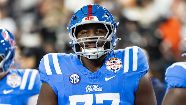 Jan 8, 2026; Glendale, AZ, USA; Mississippi Rebels offensive lineman Ethan Fields (77) against the Miami Hurricanes during the 2026 Fiesta Bowl and semifinal game of the College Football Playoff at State Farm Stadium. Mandatory Credit: Mark J. Rebilas-Imagn Images