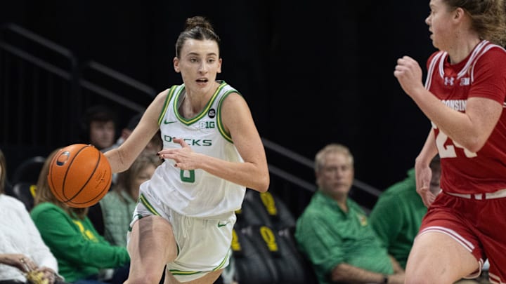 Oregon’s Elisa Mevius, left, brings the ball down court against Wisconsin at Matthew Knight Arena in Eugene Thursday, Jan. 4, 2025.