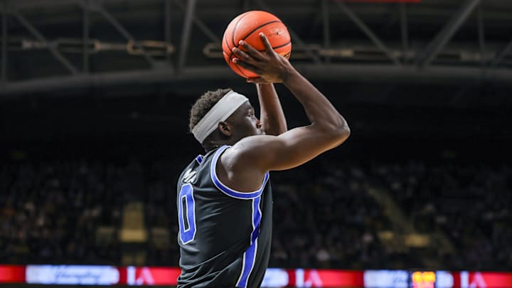 Feb 1, 2025; Orlando, Florida, USA; Brigham Young Cougars forward Mawot Mag (0) shoots the ball during the second half against the UCF Knights at Addition Financial Arena. Mandatory Credit: Mike Watters-Imagn Images