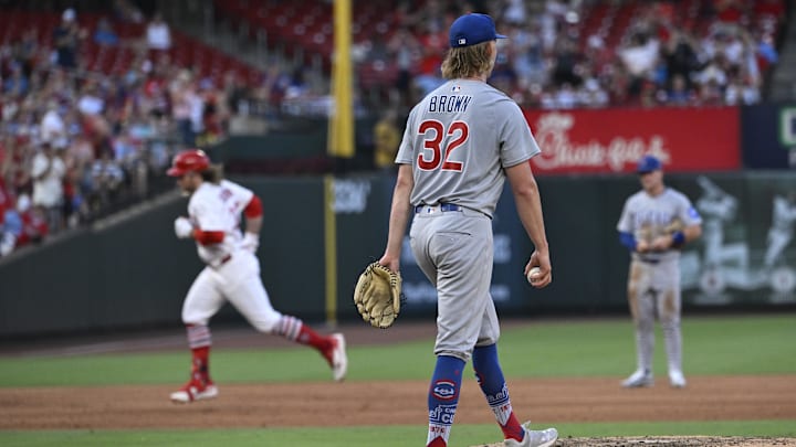 Jun 23, 2025; St. Louis, Missouri, USA; Chicago Cubs starting pitcher Ben Brown (32) watches as St. Louis Cardinals second baseman Brendan Donovan (33) rounds the bases after hitting a two-run home run in the fifth inning at Busch Stadium.