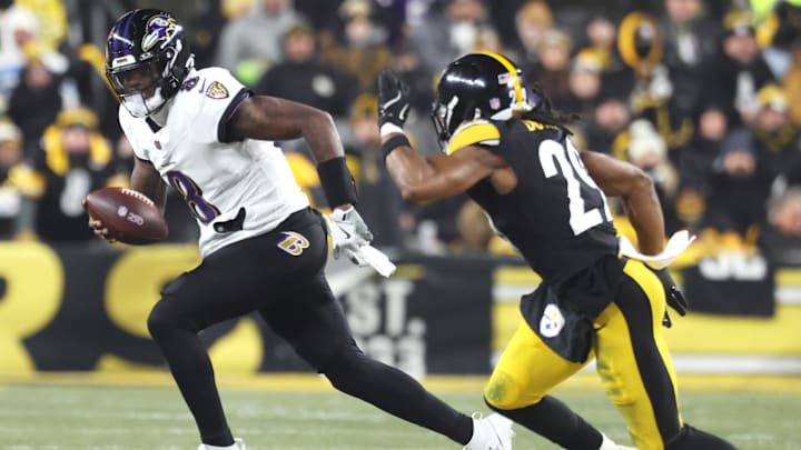 Jan 4, 2026; Pittsburgh, Pennsylvania, USA; Baltimore Ravens quarterback Lamar Jackson (8) rushes the ball past Pittsburgh Steelers safety Kyle Dugger (29) during the first half at Acrisure Stadium. Mandatory Credit: Charles LeClaire-Imagn Images Jan 4, 2026; Pittsburgh, Pennsylvania, USA; Baltimore Ravens quarterback Lamar Jackson (8) rushes the ball past Pittsburgh Steelers safety Kyle Dugger (29) during the first half at Acrisure Stadium. Mandatory Credit: Charles LeClaire-Imagn Images