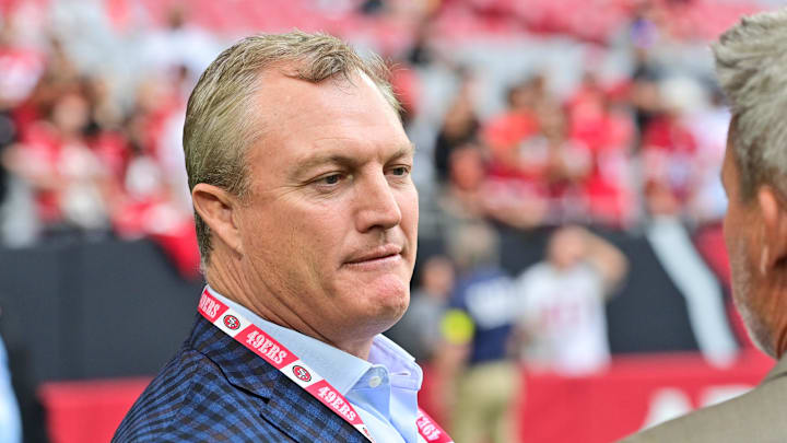 Nov 16, 2025; Glendale, Arizona, USA; San Francisco 49ers general manager John Lynch speaks on the sidelines before the game against the Arizona Cardinals at State Farm Stadium. Mandatory Credit: Matt Kartozian-Imagn Images