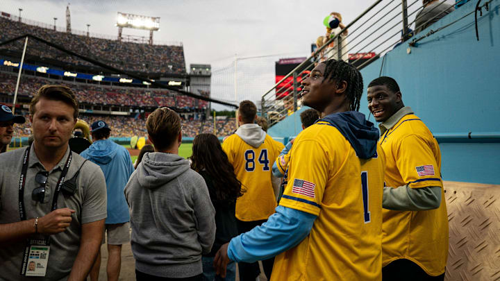 Tennessee Titans quarterback Cam Ward heads onto the field before a baseball game between the Savannah Bananas and the Party Animals at Nissan Stadium in Nashville, Tenn., Saturday, May 10, 2025.