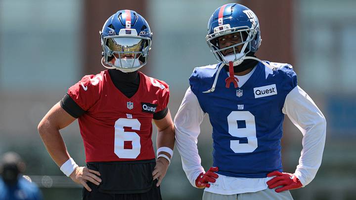  New York Giants quarterback Jaxson Dart (6) and wide receiver Isaiah Likely (9) talk during organized team activities at Quest Diagnostics Training Center. 