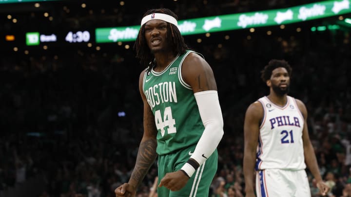 May 14, 2023; Boston, Massachusetts, USA; Boston Celtics center Robert Williams III (44) grits his teeth after being fouled while grabbing an offensive rebound as Philadelphia 76ers center Joel Embiid (21) walks away during the second quarter of game seven of the 2023 NBA playoffs at TD Garden. Mandatory Credit: Winslow Townson-USA TODAY Sports