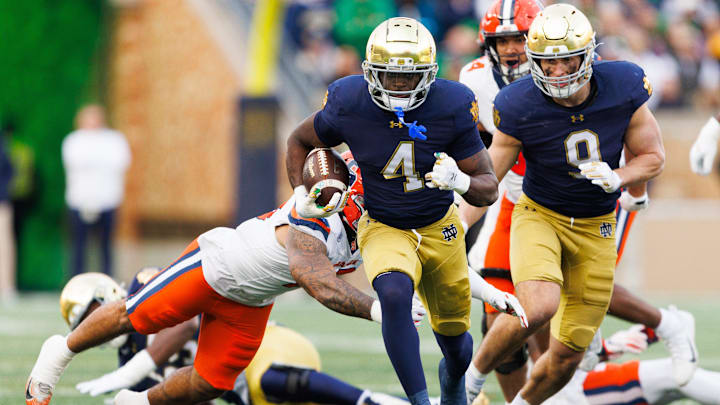 Notre Dame running back Jeremiyah Love (4) runs with the ball on his way to score a touchdown in the first half of a NCAA football game against Syracuse at Notre Dame Stadium on Saturday, Nov. 22, 2025, in South Bend.