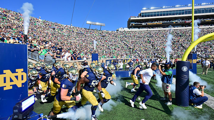 Sep 21, 2024; South Bend, Indiana, USA; Notre Dame Fighting Irish head coach Marcus Freeman leads his team onto the field for the game against the Miami Redhawks at Notre Dame Stadium. Sep 21, 2024; South Bend, Indiana, USA; Notre Dame Fighting Irish head coach Marcus Freeman leads his team onto the field for the game against the Miami Redhawks at Notre Dame Stadium.