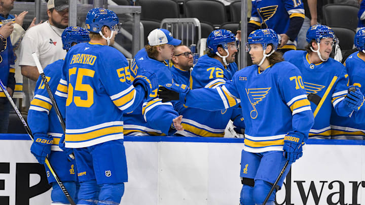 Oct 2, 2025; St. Louis, Missouri, USA; St. Louis Blues center Oskar Sundqvist (70) is congratulated by defenseman Colton Parayko (55) after scoring against the Ottawa Senators during the first period at Enterprise Center. Mandatory Credit: Jeff Curry-Imagn Images