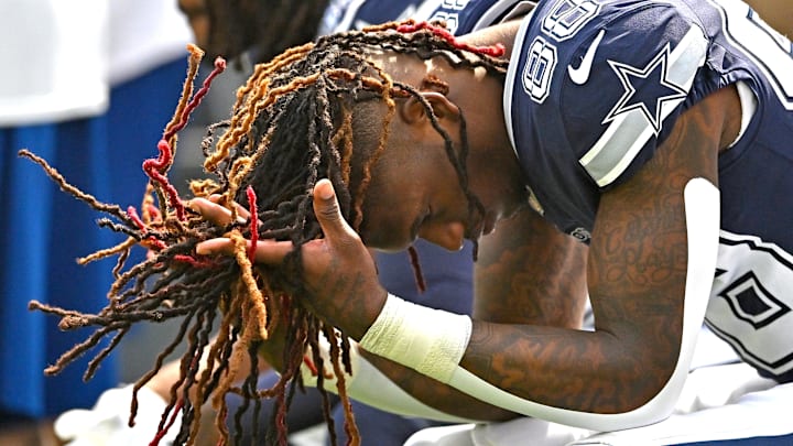 Dallas Cowboys wide receiver CeeDee Lamb sits on the bench before the start of the game against the Los Angeles Rams.