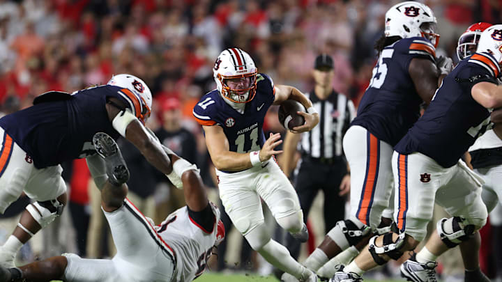 Oct 11, 2025; Auburn, Alabama, USA;  Auburn Tigers quarterback Jackson Arnold (11) carries during the second quarter against the Georgia Bulldogs at Jordan-Hare Stadium. Mandatory Credit: John Reed-Imagn Images