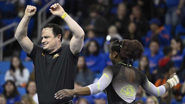 Mar 30, 2023; Los Angeles, CA, USA;  Missouri coach Shannon Welker and Amari Celestine celebrate at the end of her floor exercise routine during the NCAA Women's Gymnastics Los Angeles Regional at Pauley Pavilion. Mandatory Credit: Robert Hanashiro-Imagn Images