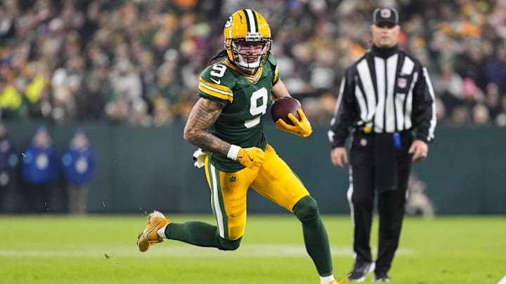 Dec 23, 2024; Green Bay, Wisconsin, USA;  Green Bay Packers wide receiver Christian Watson (9) rushes with the football during the second quarter against the New Orleans Saints at Lambeau Field. Mandatory Credit: Jeff Hanisch-Imagn Images