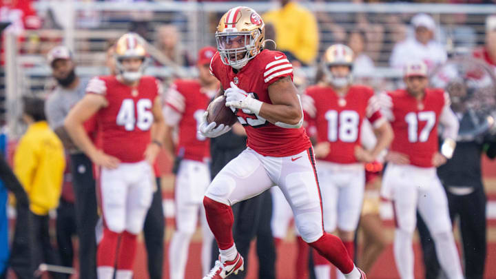 September 21, 2023; Santa Clara, California, USA; San Francisco 49ers running back Elijah Mitchell (25) runs the football against the New York Giants during the second quarter at Levi's Stadium. Mandatory Credit: Kyle Terada-Imagn Images
