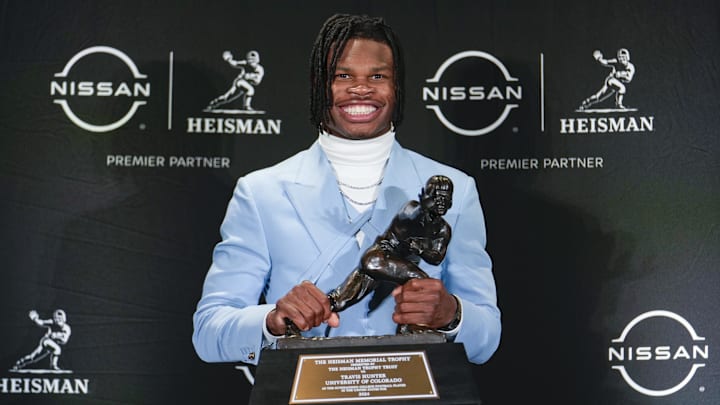 Dec 14, 2024: Travis Hunter poses for a photo after winning the Heisman Trophy award.