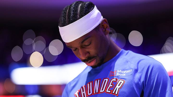 Mar 23, 2026; Philadelphia, Pennsylvania, USA; Oklahoma City Thunder guard Shai Gilgeous-Alexander during the anthem before action against the Philadelphia 76ers at Xfinity Mobile Arena. Mandatory Credit: Bill Streicher-Imagn Images Mar 23, 2026; Philadelphia, Pennsylvania, USA; Oklahoma City Thunder guard Shai Gilgeous-Alexander during the anthem before action against the Philadelphia 76ers at Xfinity Mobile Arena. Mandatory Credit: Bill Streicher-Imagn Images