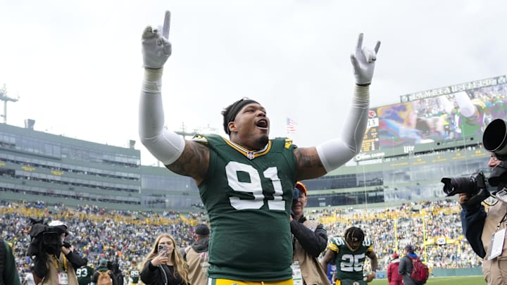 Oct 13, 2024; Green Bay, Wisconsin, USA;  Green Bay Packers defensive lineman Preston Smith (91) celebrates following the game against the Arizona Cardinals at Lambeau Field. Mandatory Credit: Jeff Hanisch-Imagn Images