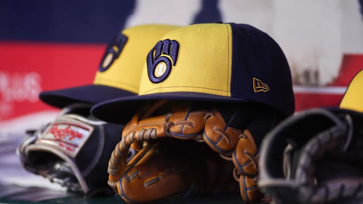Aug 4, 2025; Atlanta, Georgia, USA; A detailed view of a Milwaukee Brewers hat and glove in the dugout against the Atlanta Braves in the fourth inning at Truist Park. Mandatory Credit: Brett Davis-Imagn Images Aug 4, 2025; Atlanta, Georgia, USA; A detailed view of a Milwaukee Brewers hat and glove in the dugout against the Atlanta Braves in the fourth inning at Truist Park. Mandatory Credit: Brett Davis-Imagn Images