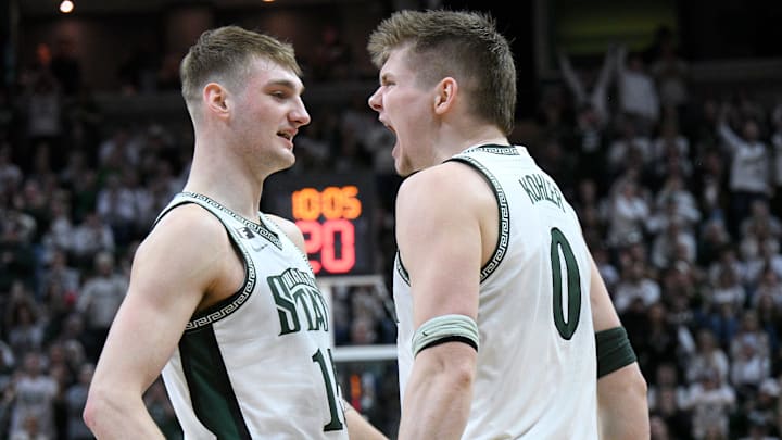 Feb 8, 2025; East Lansing, Michigan, USA; Michigan State Spartans forward Jaxon Kohler (0) and Michigan State Spartans center Carson Cooper (15) celebrate during the second half at Jack Breslin Student Events Center. Mandatory Credit: Dale Young-Imagn Images