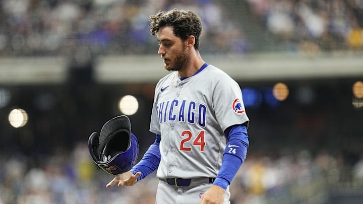 Jun 28, 2024; Milwaukee, Wisconsin, USA;  Chicago Cubs right fielder Cody Bellinger (24) flips his helmet after being involved in a double play during the sixth inning against the Milwaukee Brewers at American Family Field. Mandatory Credit: Jeff Hanisch-Imagn Images
