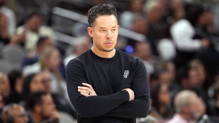 Apr 6, 2026; San Antonio, Texas, USA; San Antonio Spurs head coach Mitch Johnson observes the first half of play against the Philadelphia 76ers at Frost Bank Center. Mandatory Credit: Scott Wachter-Imagn Images