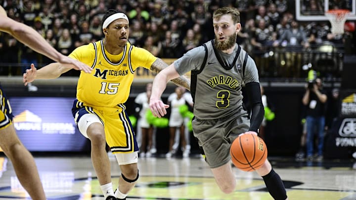 Purdue Boilermakers guard Braden Smith drives the ball down court past Michigan Wolverines guard Rubin Jones Purdue Boilermakers guard Braden Smith drives the ball down court past Michigan Wolverines guard Rubin Jones