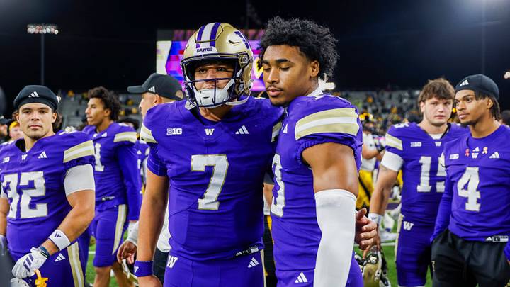 Quarterback Elijah Brown (7) stands with cornerback Rahsjon Duncan (13) following a loss to Iowa.