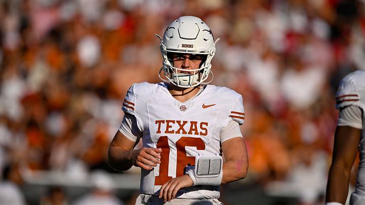 Texas Longhorns quarterback Arch Manning (16) runs back on the field during the game between the Sooners and the Longhorns at Cotton Bowl. Texas Longhorns quarterback Arch Manning (16) runs back on the field during the game between the Sooners and the Longhorns at Cotton Bowl.