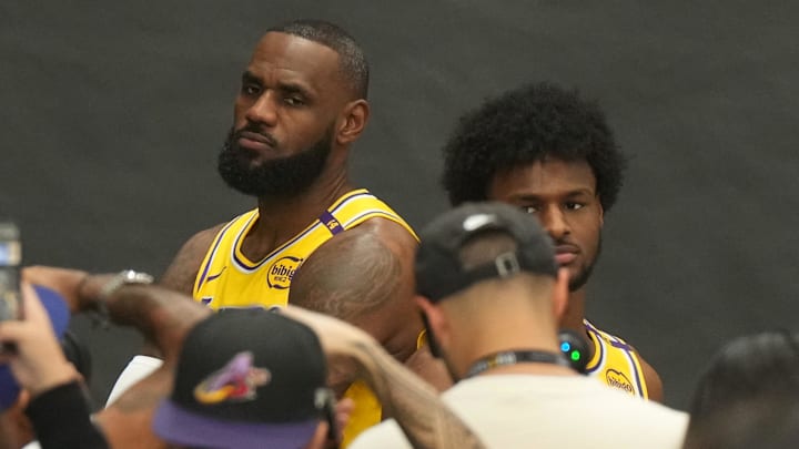 Sep 30, 2024; El Segundo, CA, USA; Los Angeles Lakers forward LeBron James (left) poses with son Bronny James during media day at the UCLA Health Training Center. Mandatory Credit: Kirby Lee-Imagn Images