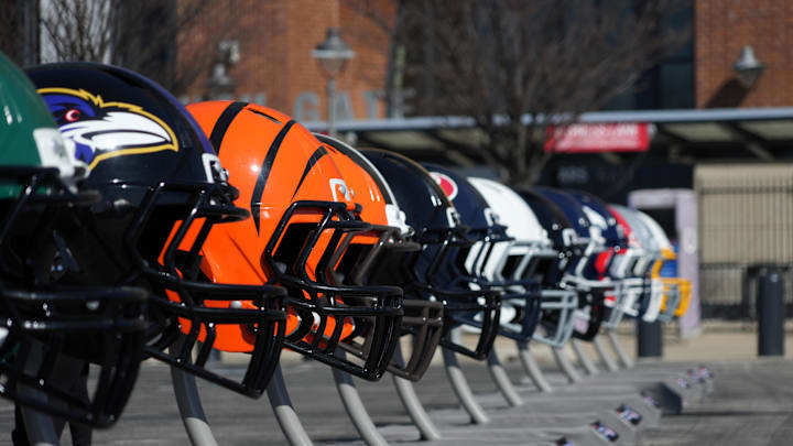 Feb 28, 2024; Indianapolis, IN, USA; A general view of large Baltimore Ravens and Cincinnati Bengals helmets at the NFL Scouting Combine Experience at Lucas Oil Stadium. Mandatory Credit: Kirby Lee-Imagn Images