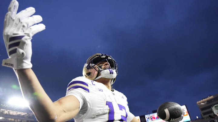 Washington Huskies wide receiver Denzel Boston (12) celebrates after scoring a touchdown during the second quarter against the Wisconsin Badgers at Camp Randall Stadium. Mandatory Credit: Jeff Hanisch-Imagn Images