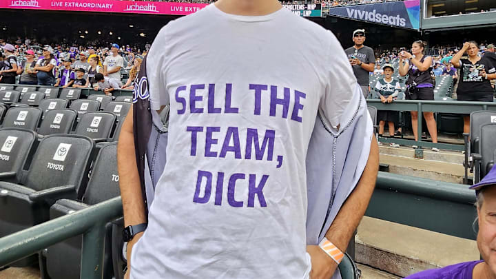 Colorado Rockies fan begging Dick Monfort for change.