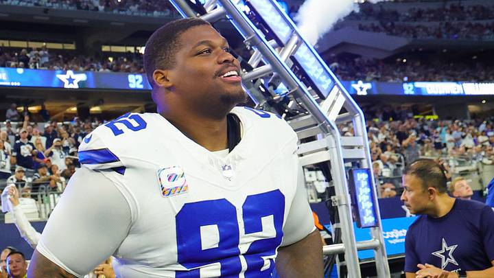 Dallas Cowboys defensive tackle Quinnen Williams runs onto the field before the game against the Tampa Bay Buccaneers at AT&T Stadium. Dallas Cowboys defensive tackle Quinnen Williams runs onto the field before the game against the Tampa Bay Buccaneers at AT&T Stadium.