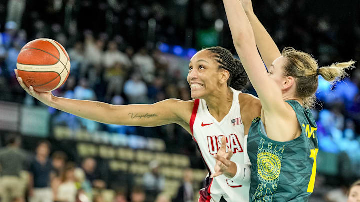 Aug 9, 2024; Paris, France; United States forward A'Ja Wilson (9) attempts a layup while Australia forward Alanna Smith (11) goes to block in a women's basketball semifinal game during the Paris 2024 Olympic Summer Games at Accor Arena. Mandatory Credit: Kyle Terada-Imagn Images