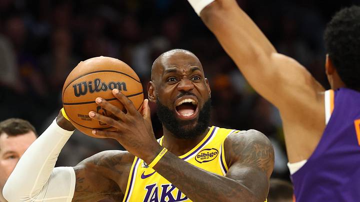 Feb 26, 2026; Phoenix, Arizona, USA; Los Angeles Lakers forward LeBron James (23) reacts as he looks to pass the ball against Phoenix Suns forward Ryan Dunn (0) in the second half at Mortgage Matchup Center. Mandatory Credit: Mark J. Rebilas-Imagn Images