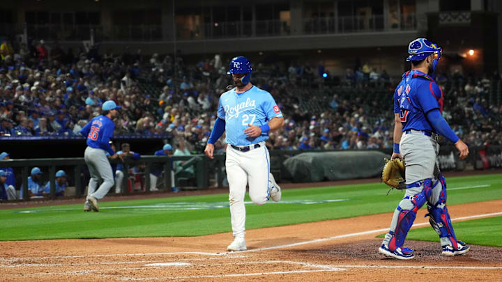 Mar 5, 2024; Surprise, Arizona, USA; Kansas City Royals right fielder Tyler Gentry (27) scores a run against the Chicago Cubs during the third inning at Surprise Stadium. Mandatory Credit: Joe Camporeale-Imagn Images