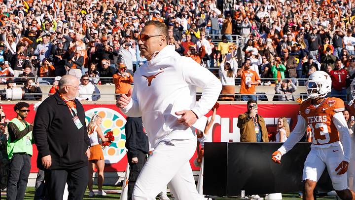 Texas Longhorns head coach Steve Sarkisian, runs onto the field before a game against the Michigan Wolverines. Texas Longhorns head coach Steve Sarkisian, runs onto the field before a game against the Michigan Wolverines.