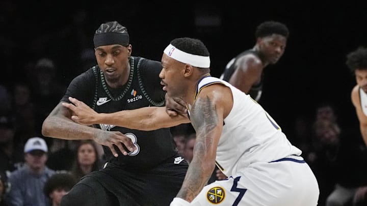 Apr 23, 2026; Minneapolis, Minnesota, USA; Denver Nuggets guard Bruce Brown (11) works around Minnesota Timberwolves forward Jaden McDaniels (3) in the second quarter at Target Center. Mandatory Credit: Bruce Kluckhohn-Imagn Images