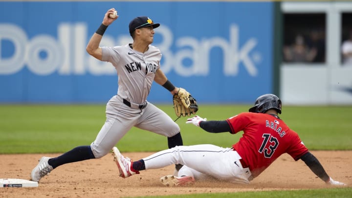 Apr 14, 2024; Cleveland, Ohio, USA; New York Yankees shortstop Anthony Volpe (11) tags second base to force out Cleveland Guardians shortstop Gabriel Arias (13) during the ninth inning at Progressive Field. Apr 14, 2024; Cleveland, Ohio, USA; New York Yankees shortstop Anthony Volpe (11) tags second base to force out Cleveland Guardians shortstop Gabriel Arias (13) during the ninth inning at Progressive Field.