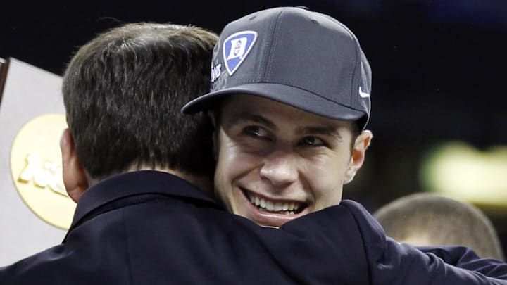 Apr 5, 2010; Indianapolis, IN, USA; Duke Blue Devils head coach Mike Krzyzewski (left) hugs guard Jon Scheyer after defeating the Butler Bulldogs 61-59 in the national championship game of the Final Four of the 2010 NCAA mens basketball tournament at Lucas Oil Stadium. Mandatory Credit: Bob Donnan-Imagn Images