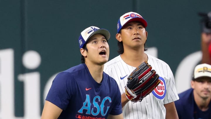 Jul 15, 2024; Arlington, TX, USA; Los Angeles Dodgers pitcher Shohei Ohtani warms up with Chicago Cubs pitcher Shota Imanaga before the 2024 Home Run Derby at Globe Life Field.