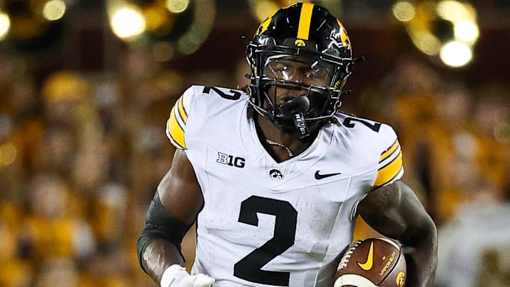 Sep 21, 2024; Minneapolis, Minnesota, USA; Iowa Hawkeyes running back Kaleb Johnson (2) runs the ball against the Minnesota Golden Gophers during the second half at Huntington Bank Stadium.